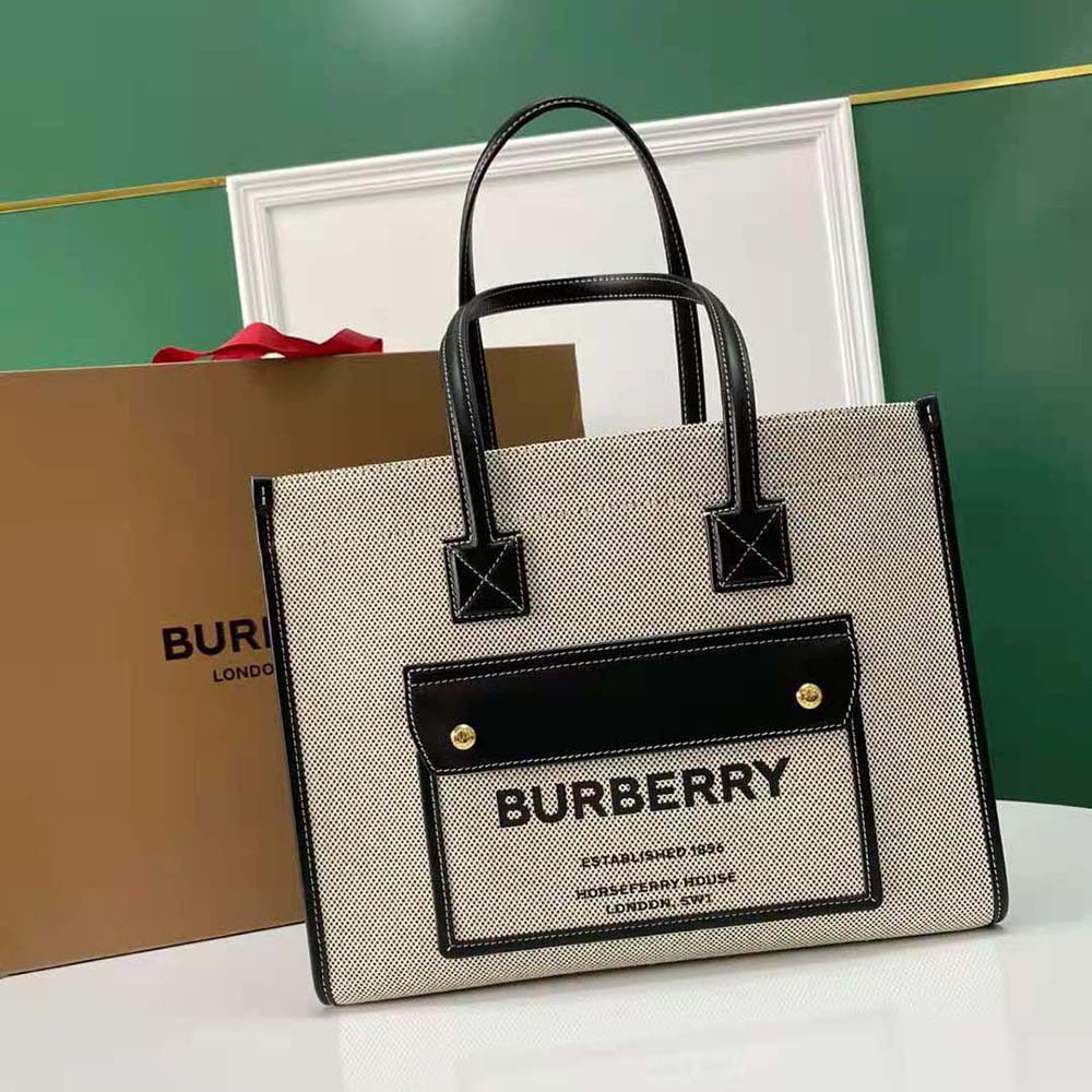 Close-up of leather handle and Burberry check hardware on Freya Tote