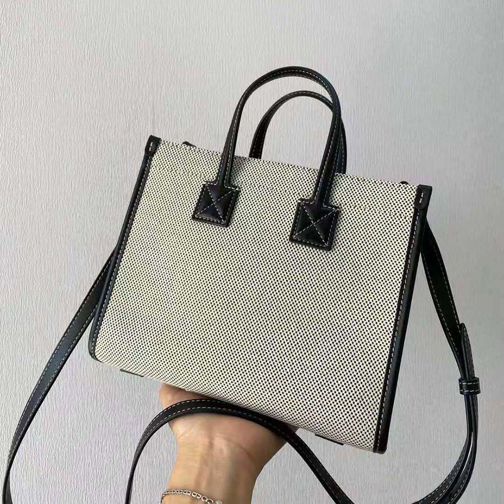 Side angle showing mini silhouette of Burberry Women Freya Bag in silver
