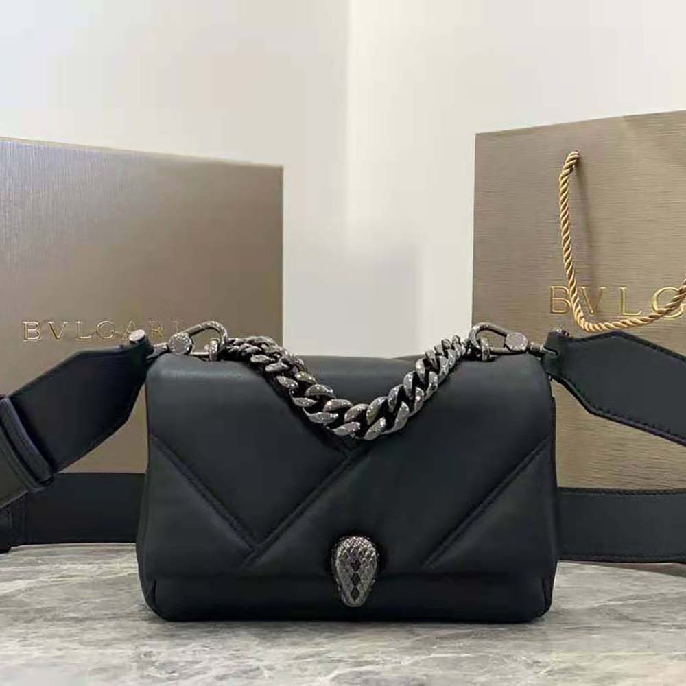 Close-up on gold serpent head clasp of Bvlgari Serpenti Mini Bag