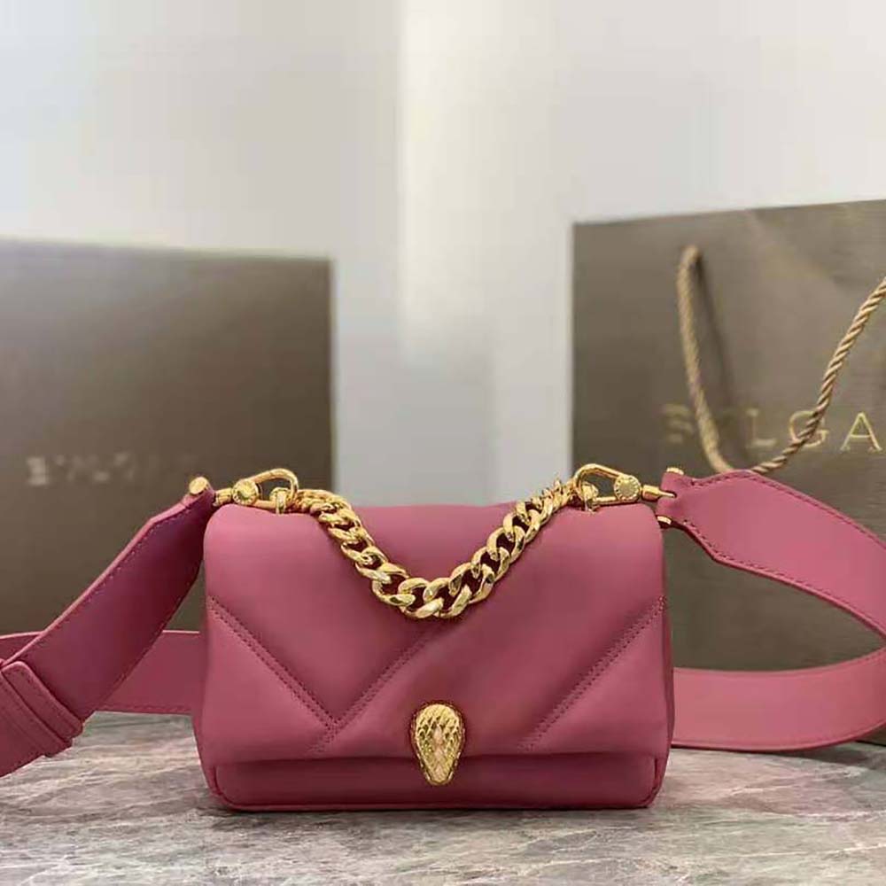 Close-up of signature Serpenti cabochon clasp on pink mini bag
