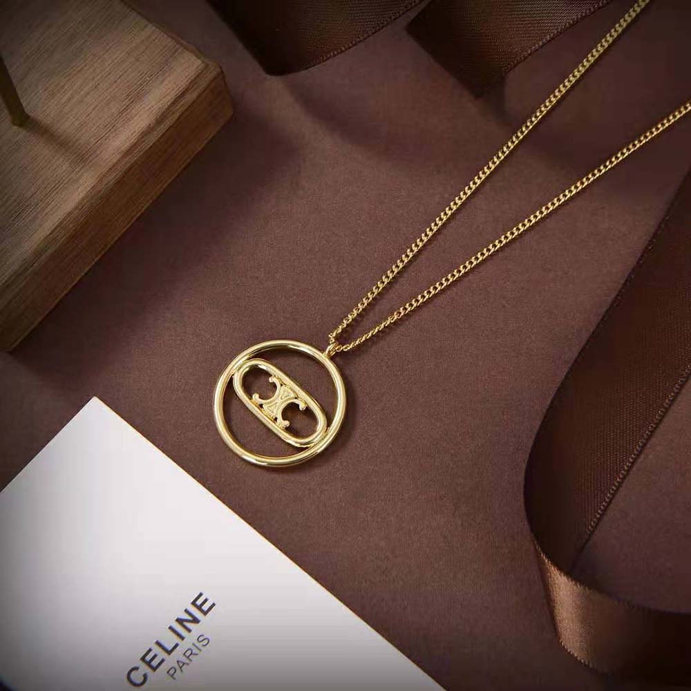 Side angle showing clasp and thick chain of Celine gold necklace