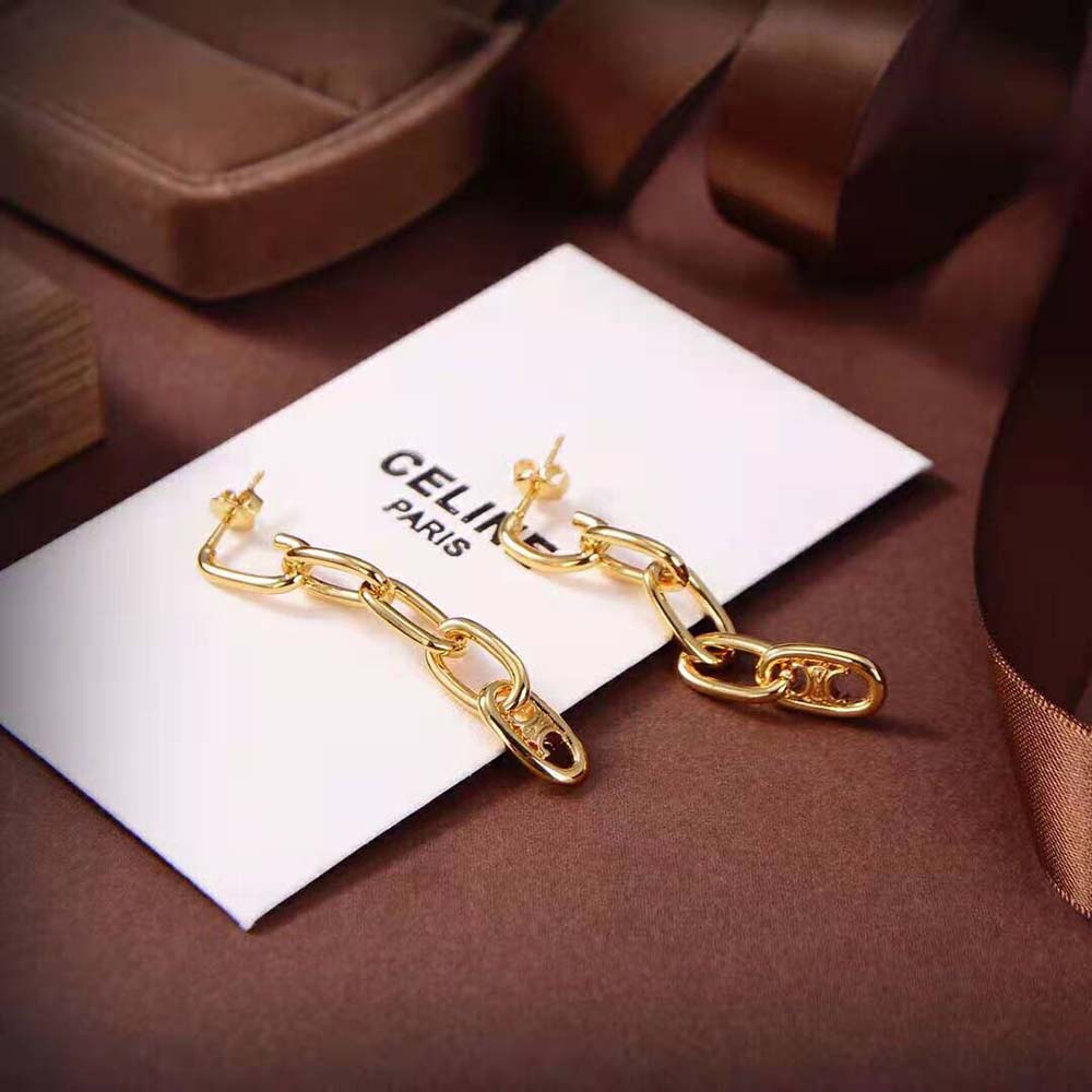 Close-up of gold Maillon Triomphe hardware detail on earrings