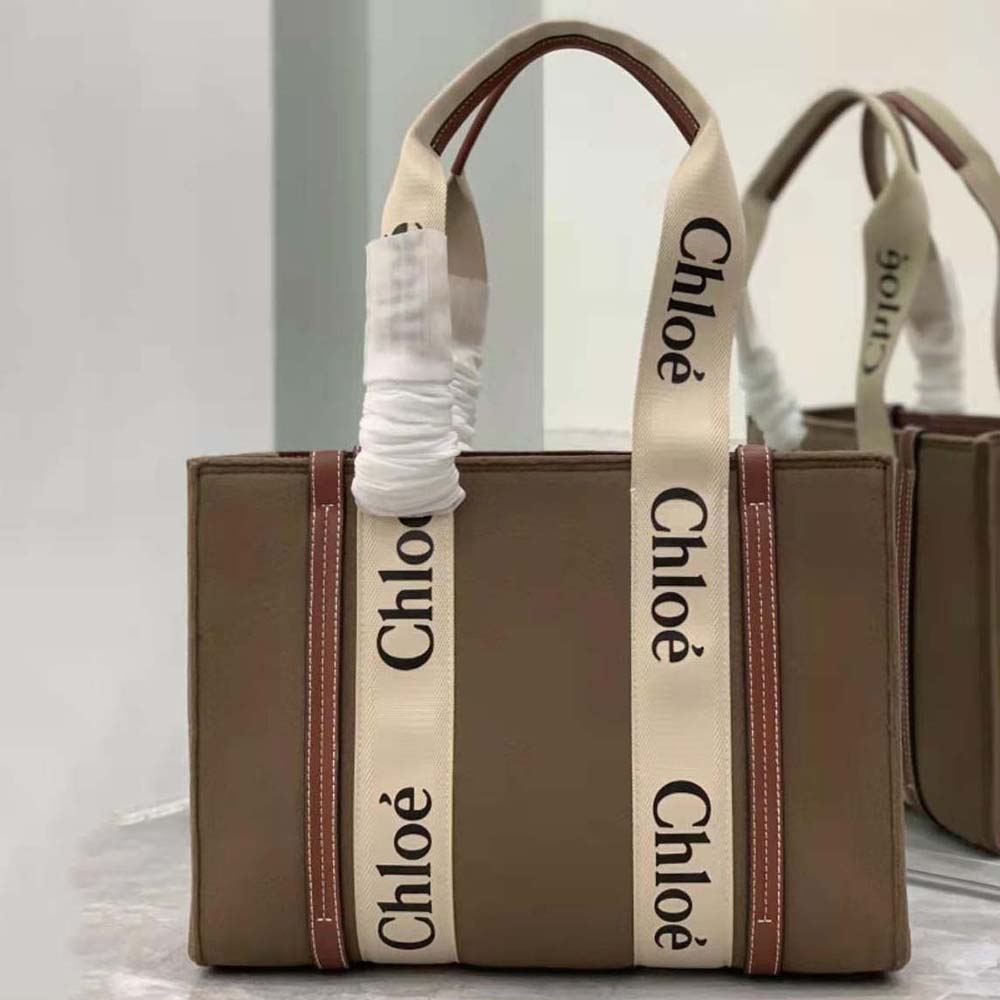 Close-up of gold-tone braided leather handles on the Chloe Medium Woody Tote Bag-Brown