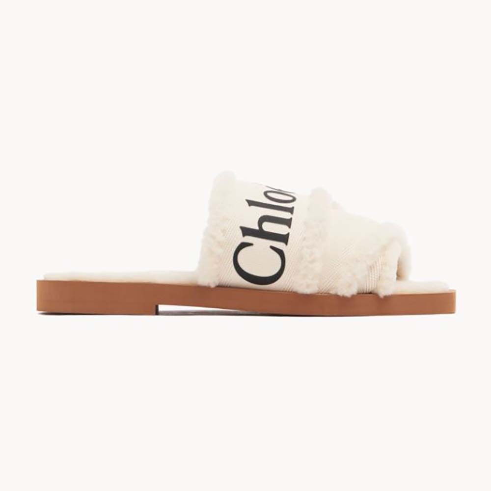 Side view of Chloe Women Woody Flat Mule in white canvas with shearling