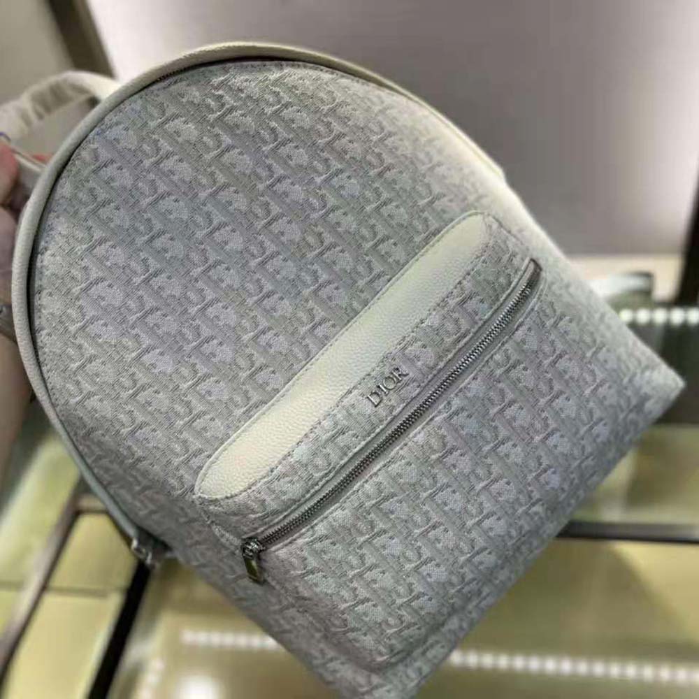 Close-up of silver hardware on Dior Men Rider Backpack Beige Dior Oblique Jacquard