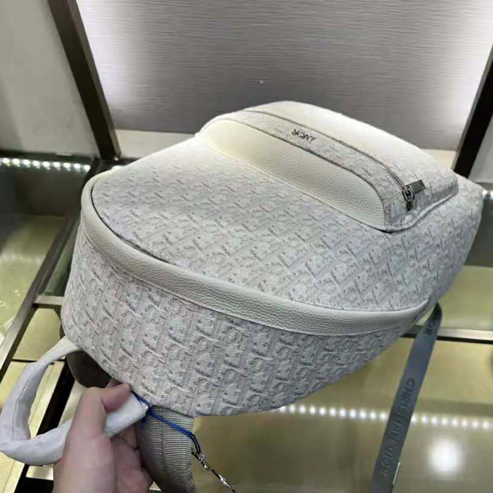 Side profile showing structured silhouette of Dior Men Rider Backpack Beige Dior Oblique Jacquard