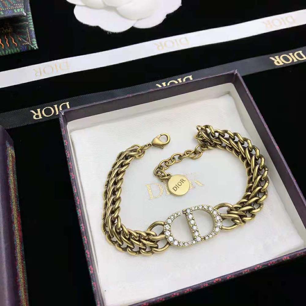Styled wrist wearing Dior Women 30 Montaigne Bracelet in natural light