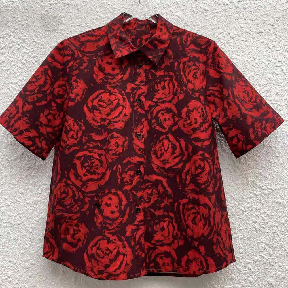 Close-up on embroidered Dior rose detail on silk taffeta blouse