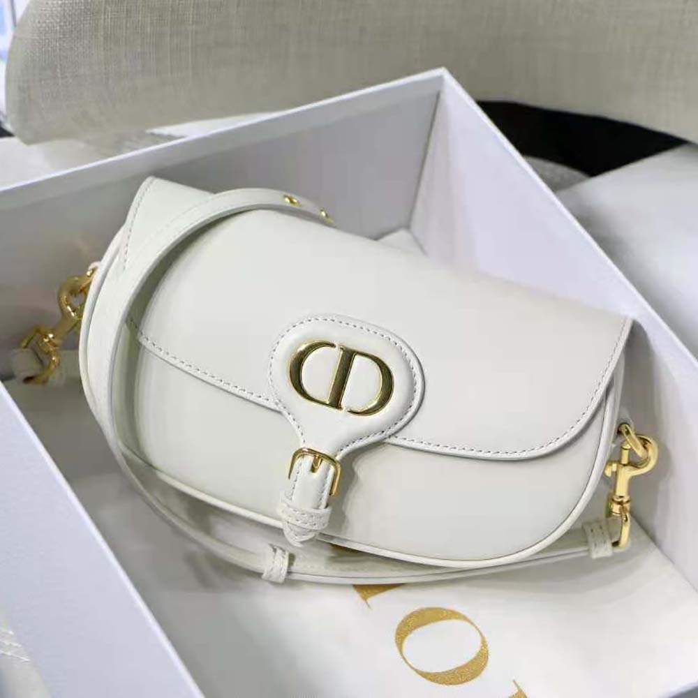 Close-up of silver-tone Dior hardware on white Bobby East-West bag