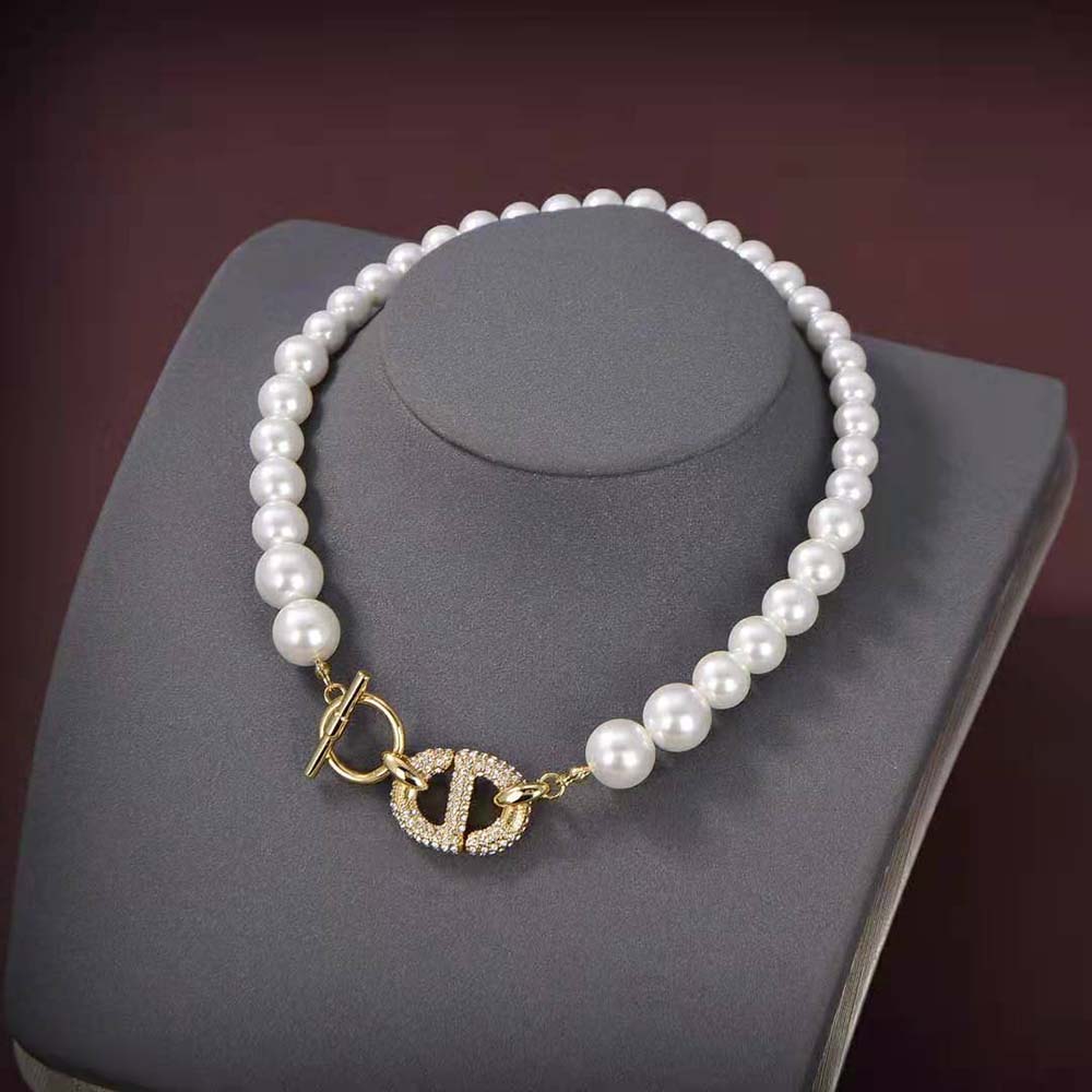 Close-up of gold-finish metal and white detail on Dior Women CD Navy Choker