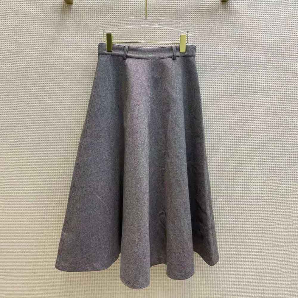 Side profile showing tailored silhouette of Dior Women Cannage Lined Mid-Length Skirt