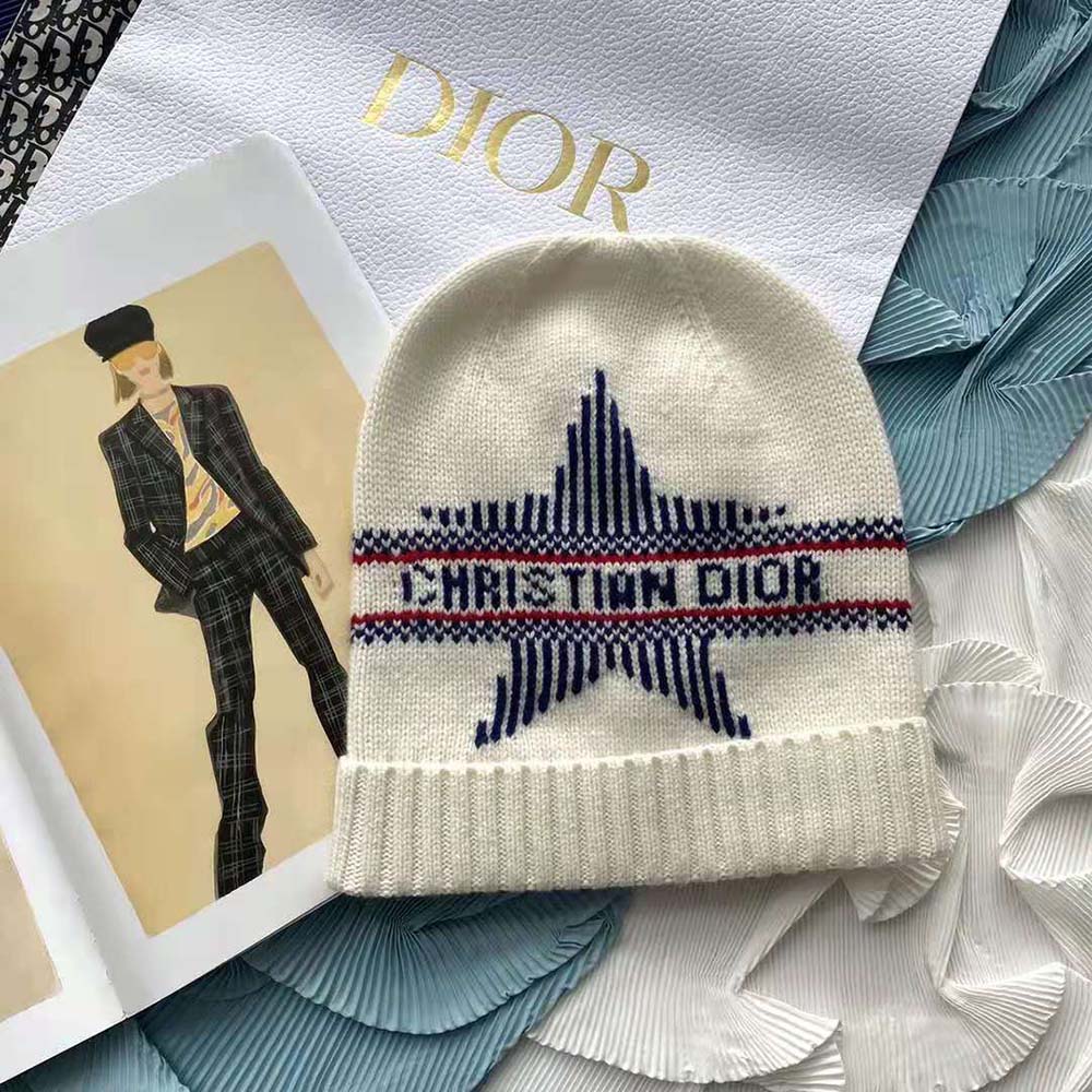 Close-up detail of Dior signature on Dioralps Beanie in white wool blend