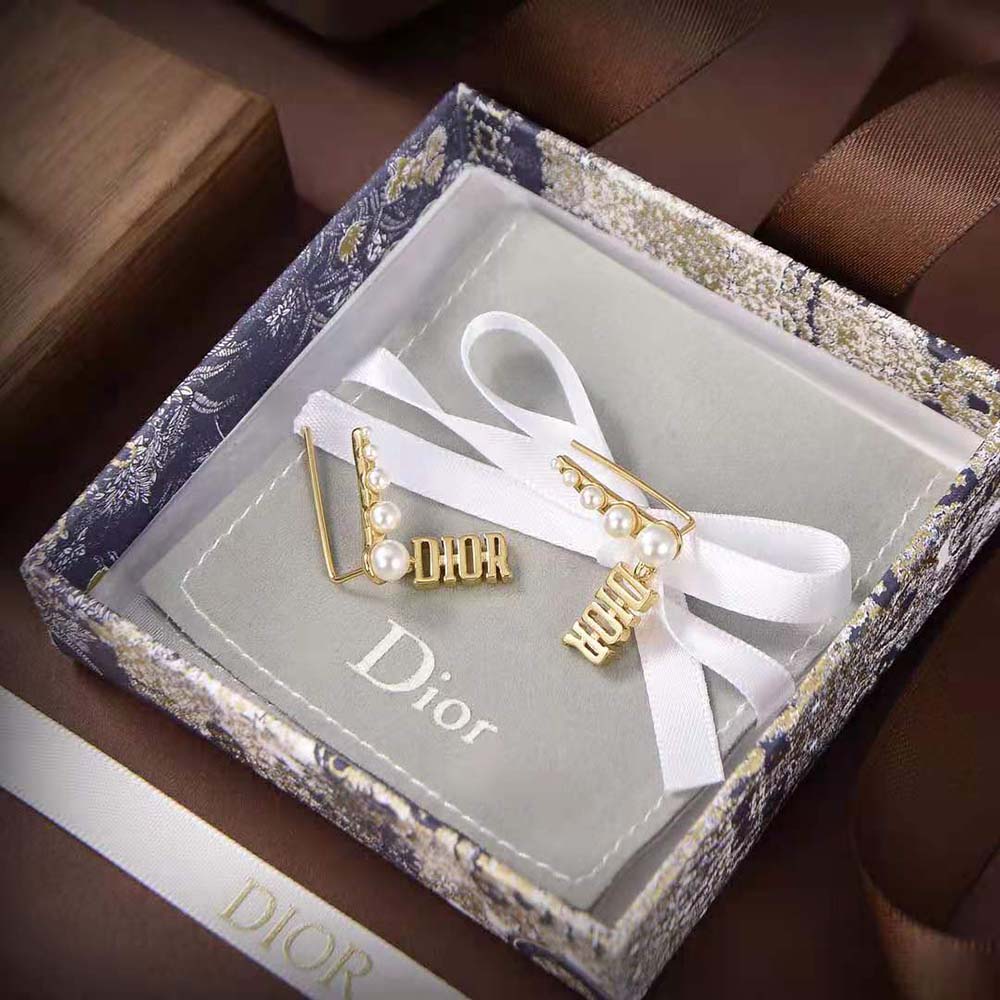 Side angle showing elegant drop silhouette of Dior Women Diorevolution Earrings