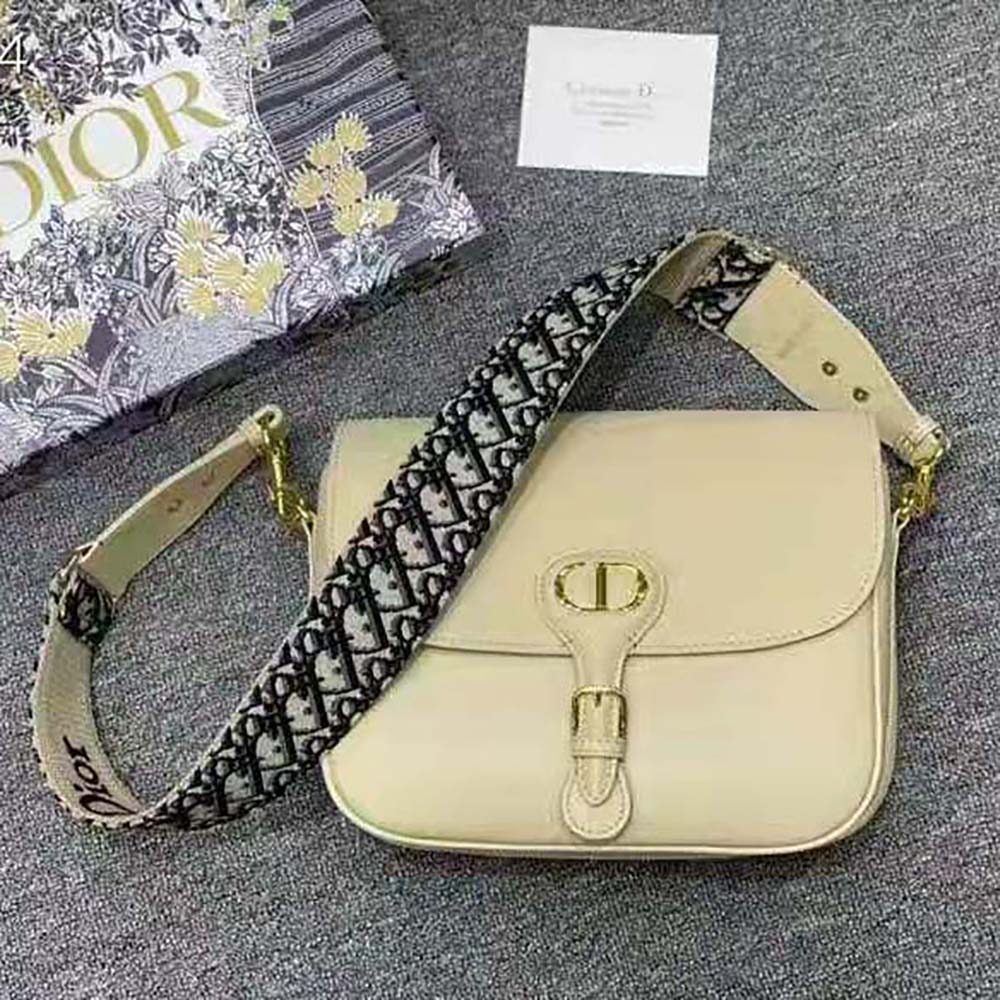 Close-up of beige box calfskin texture on Dior Women Large Dior Bobby Bag