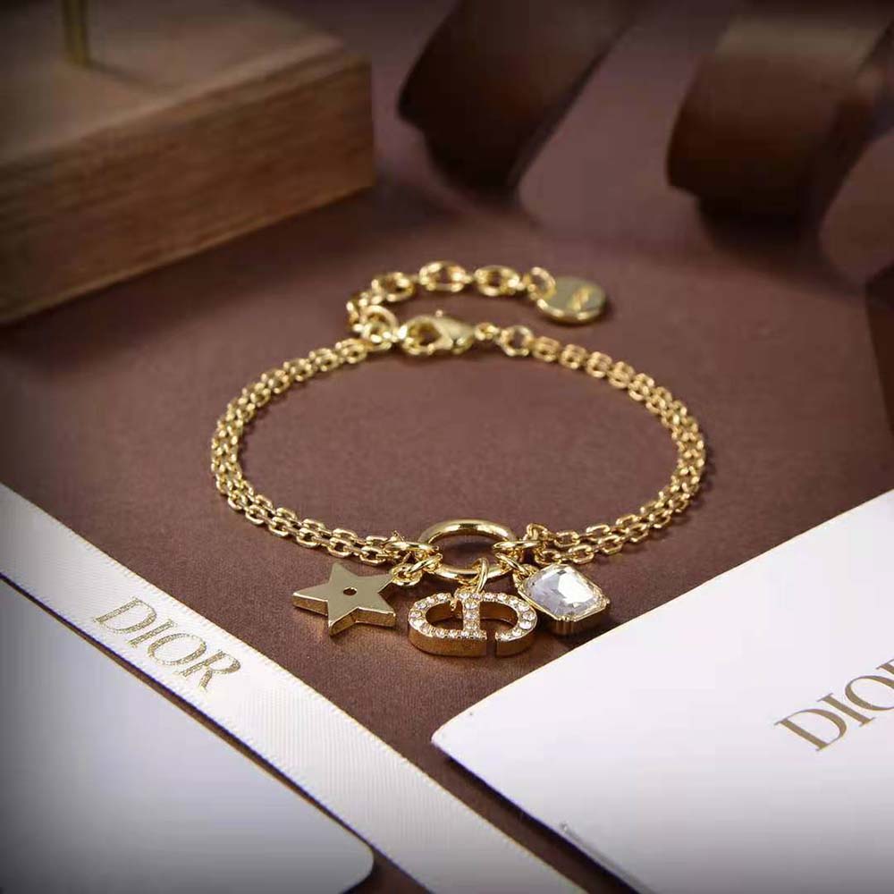Dior Women Petit CD Bracelet worn on wrist with light reflection