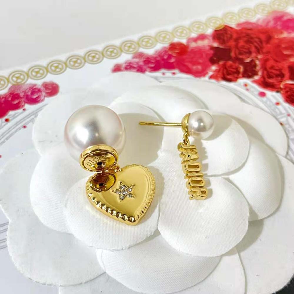 Detail of gold-finish metal and closure on Dior Women Tribales Earrings
