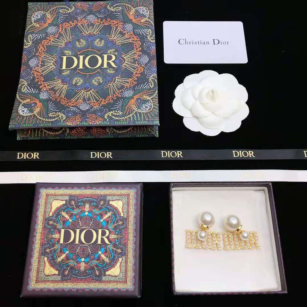 Side angle showing double-sided silhouette of Dior Women Tribales Earrings