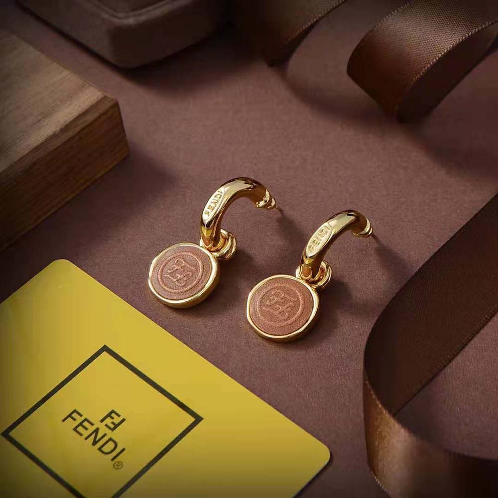 Side angle showing silhouette of Fendi Women Karligraphy Earrings Gold-Colored