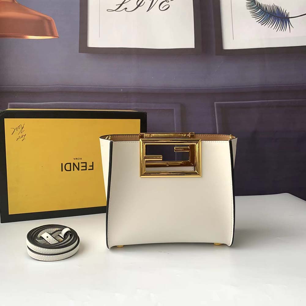 Close-up showing gold-tone hardware and Camellia-colored leather detail