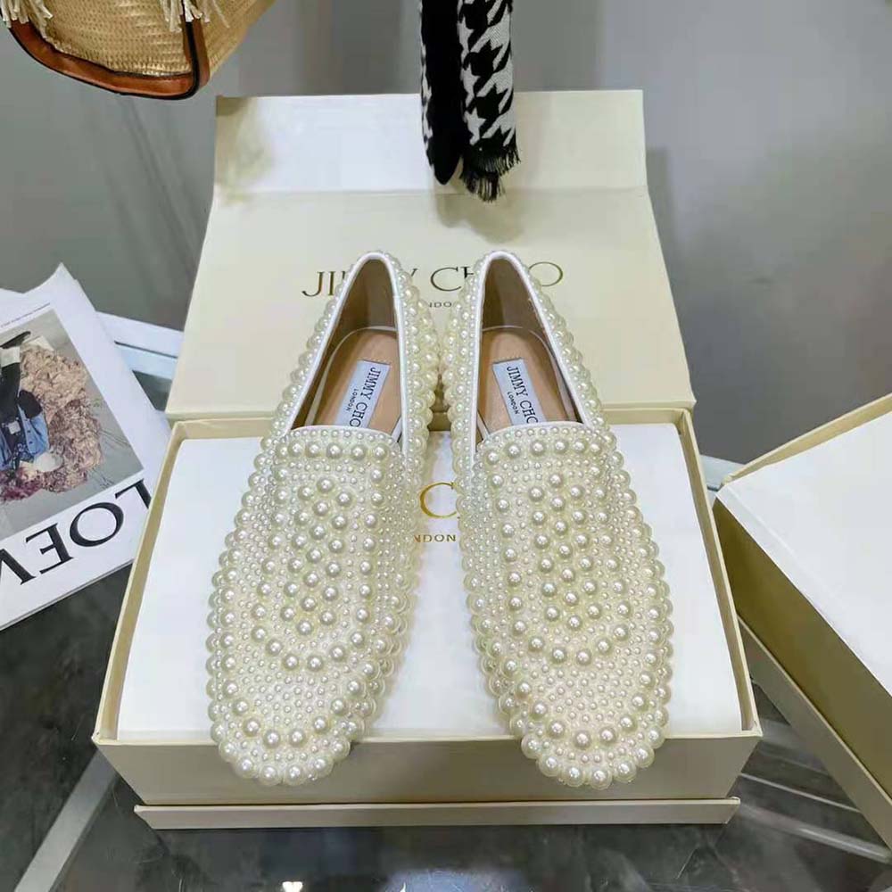 Close-up of pearl embellishment on Jimmy Choo Women Varsha Satin Flats