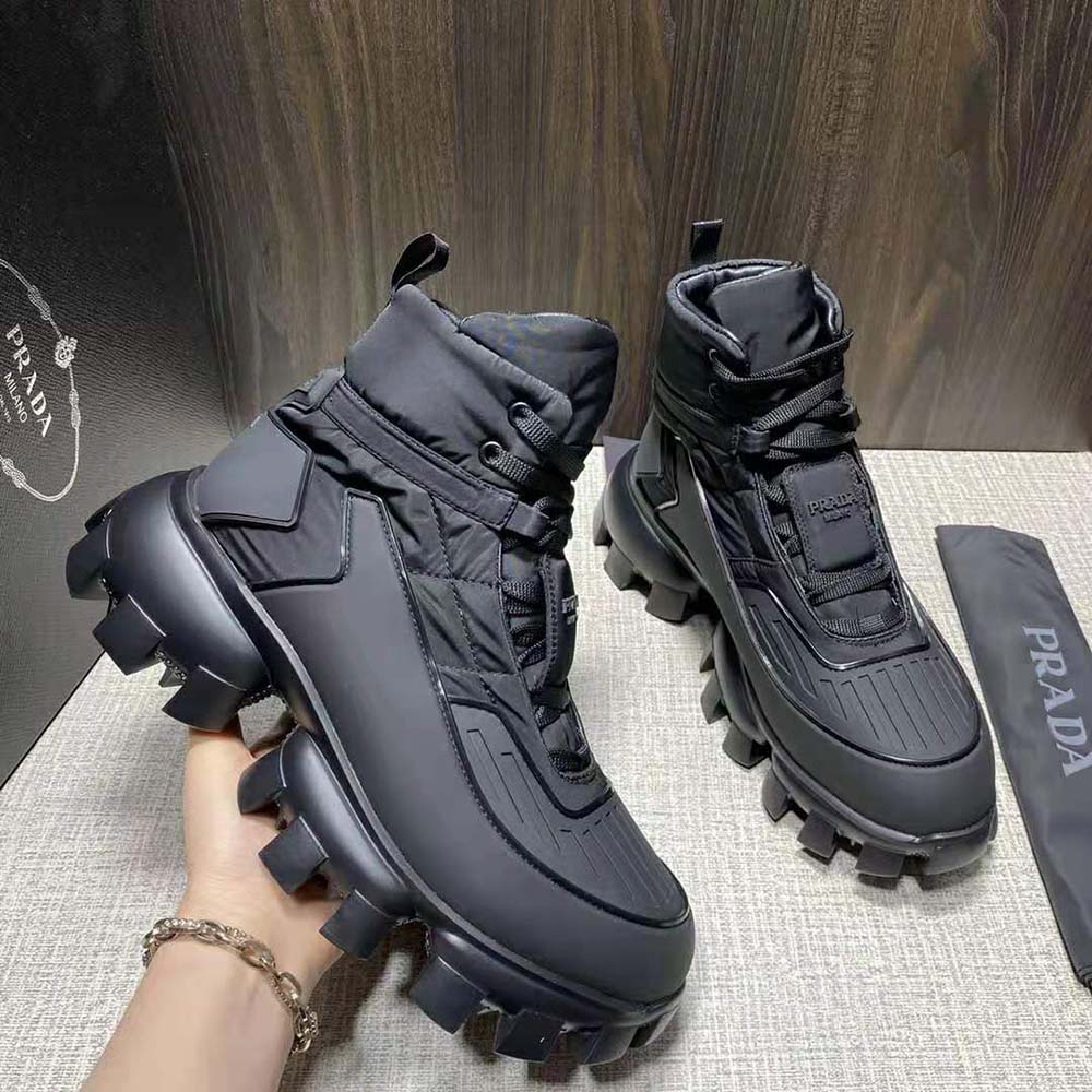 Top-down view of laces and black mesh on Prada Women Cloudbust Thunder Sneakers-Black