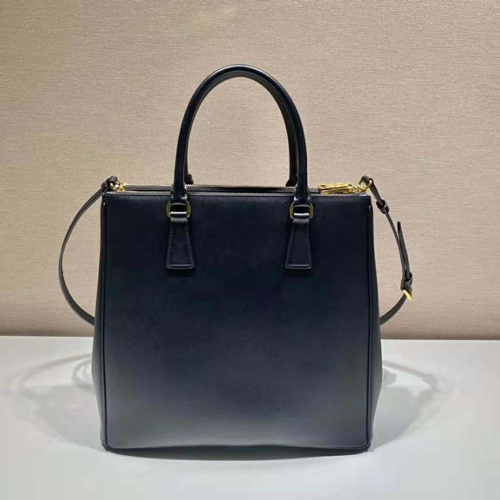 Side angle showing medium size and structured silhouette of Prada bag