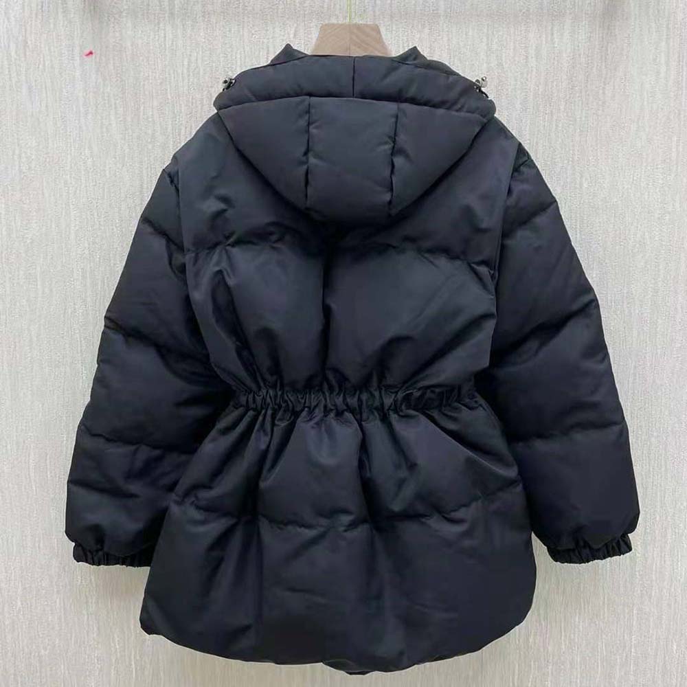 Side angle highlighting silhouette and zip closure of Prada Women Re-Nylon Down Jacket