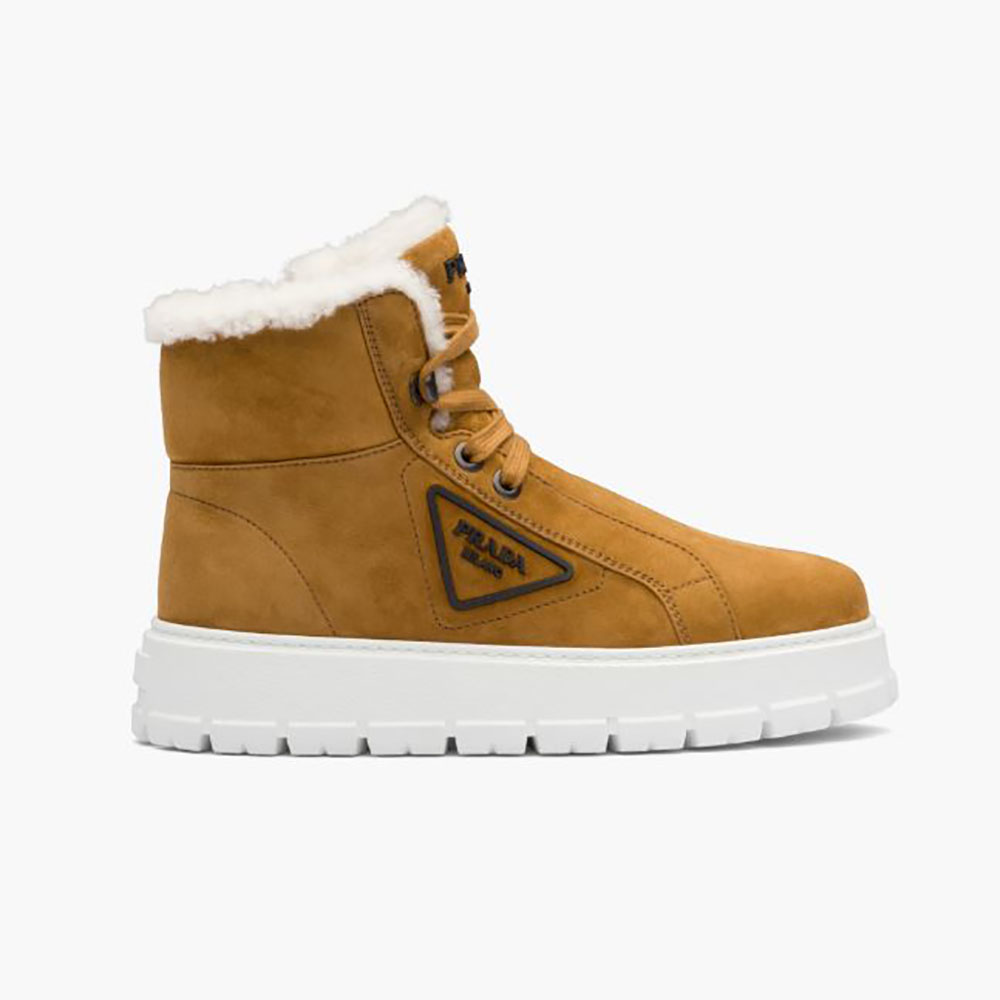 Side profile of Prada Women Suede Lace-up Booties-Brown showcasing lace detail
