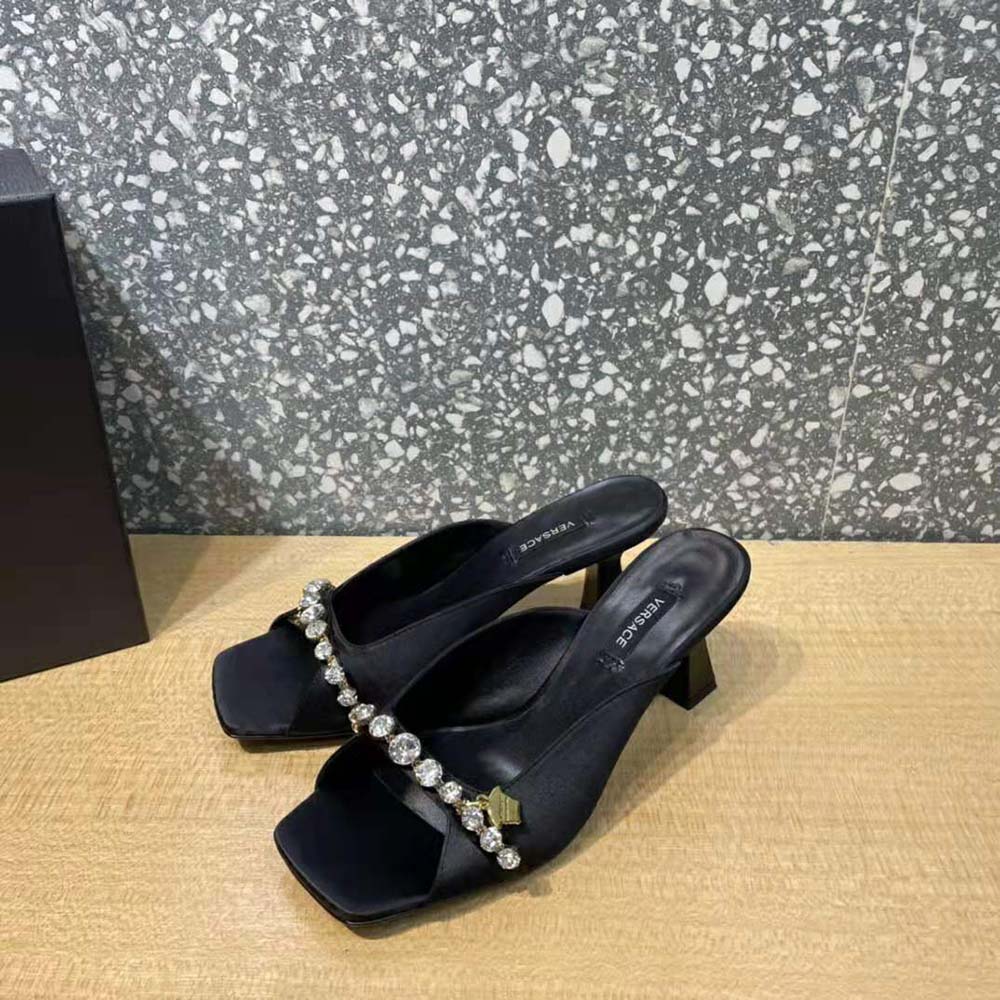 Top angle of black leather and slip-on design on Versace Women Artifact Mid-Heel Mules