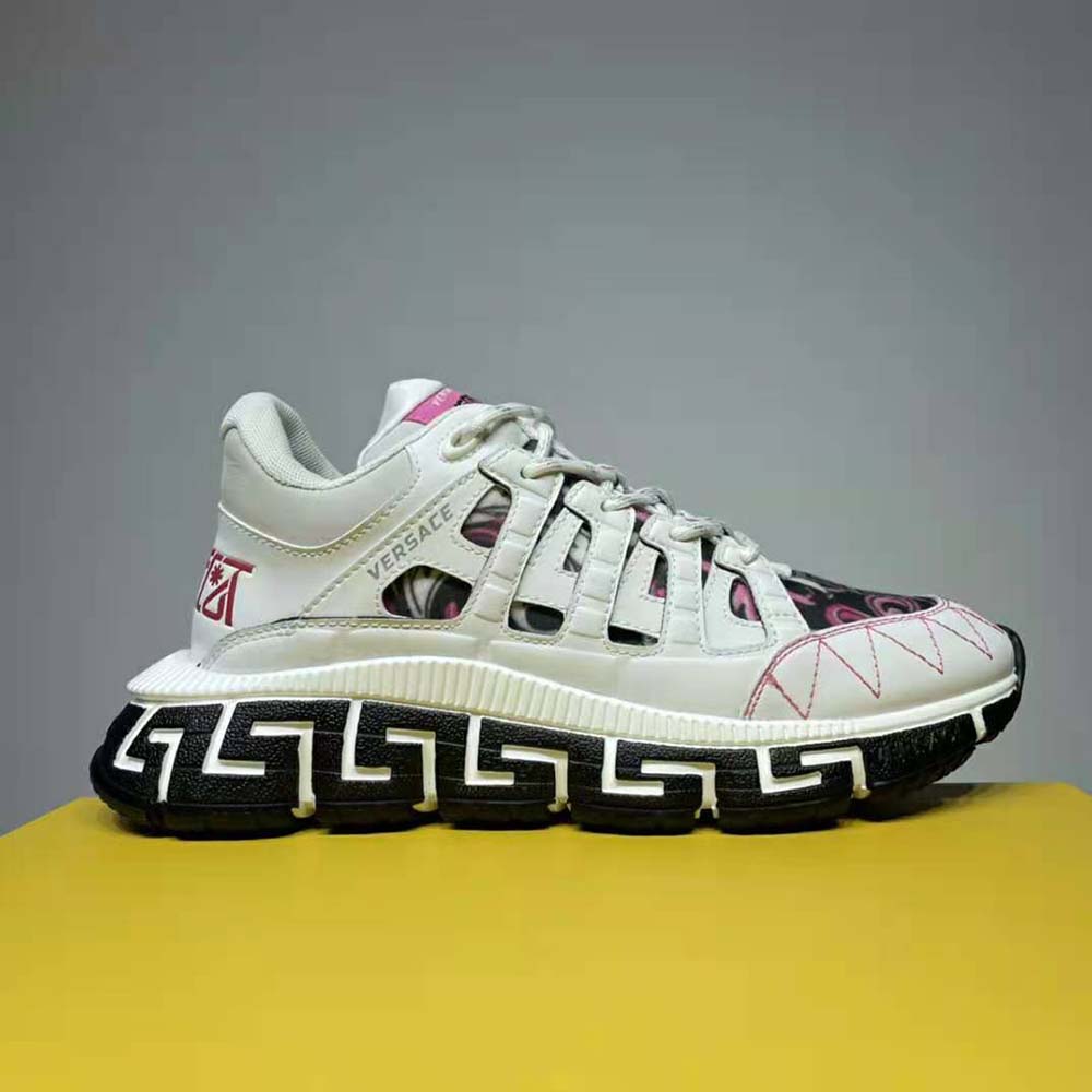 Close-up of gold Trigreca logo on Versace Women Trigreca Sneakers-White