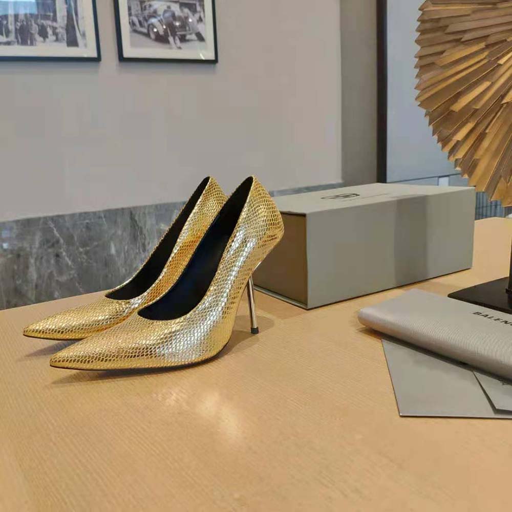 Close-up detail of gold python-effect texture on Balenciaga Essex pump
