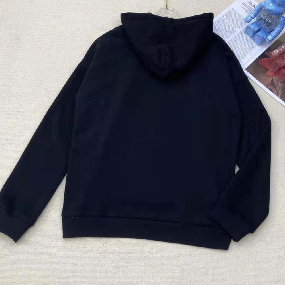Side angle showing wide fit silhouette of Balenciaga Men Simpsons Tm and 20th Television Hoodie