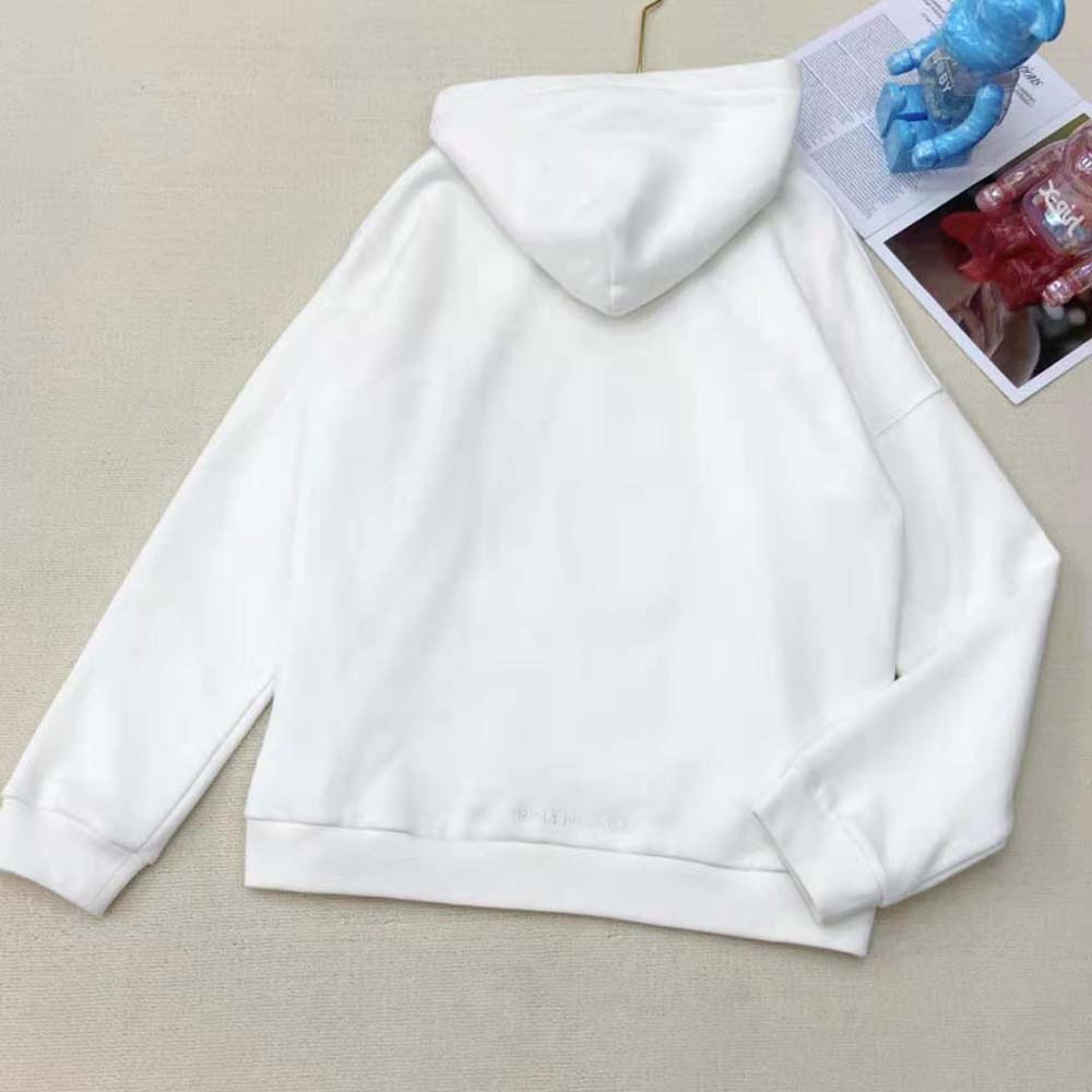 Side profile showing wide fit silhouette of Balenciaga Men Simpsons Tm and 20th Television Hoodie