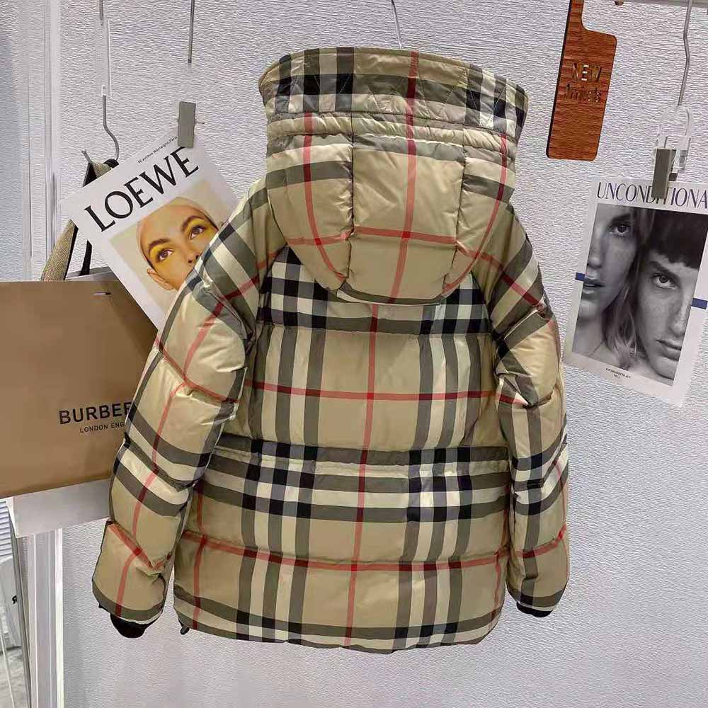 Side angle showing zipper and silhouette of Burberry Women Detachable Hood Jacket