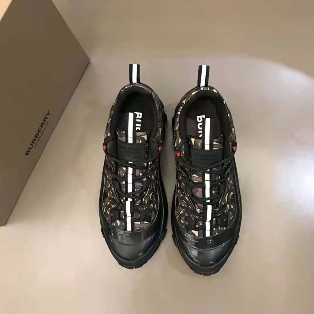 Close-up of lace-up closure and Burberry logo hardware on Arthur Sneakers