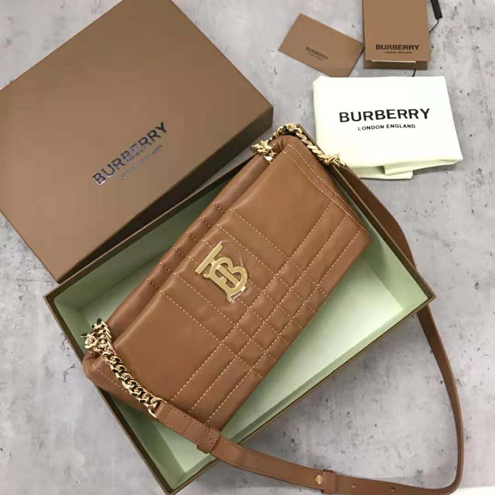 Close-up of quilted lambskin and gold hardware detail on Brown Lola bag
