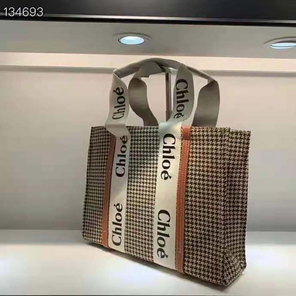 Side angle showing Chloe Women Medium Woody Tote Bag’s structured silhouette