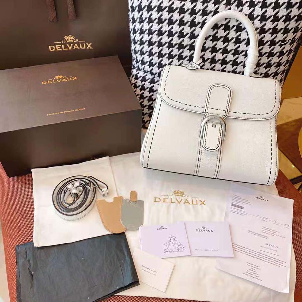 Close-up of Surpique stitching detail on Delvaux Brillant MM white leather