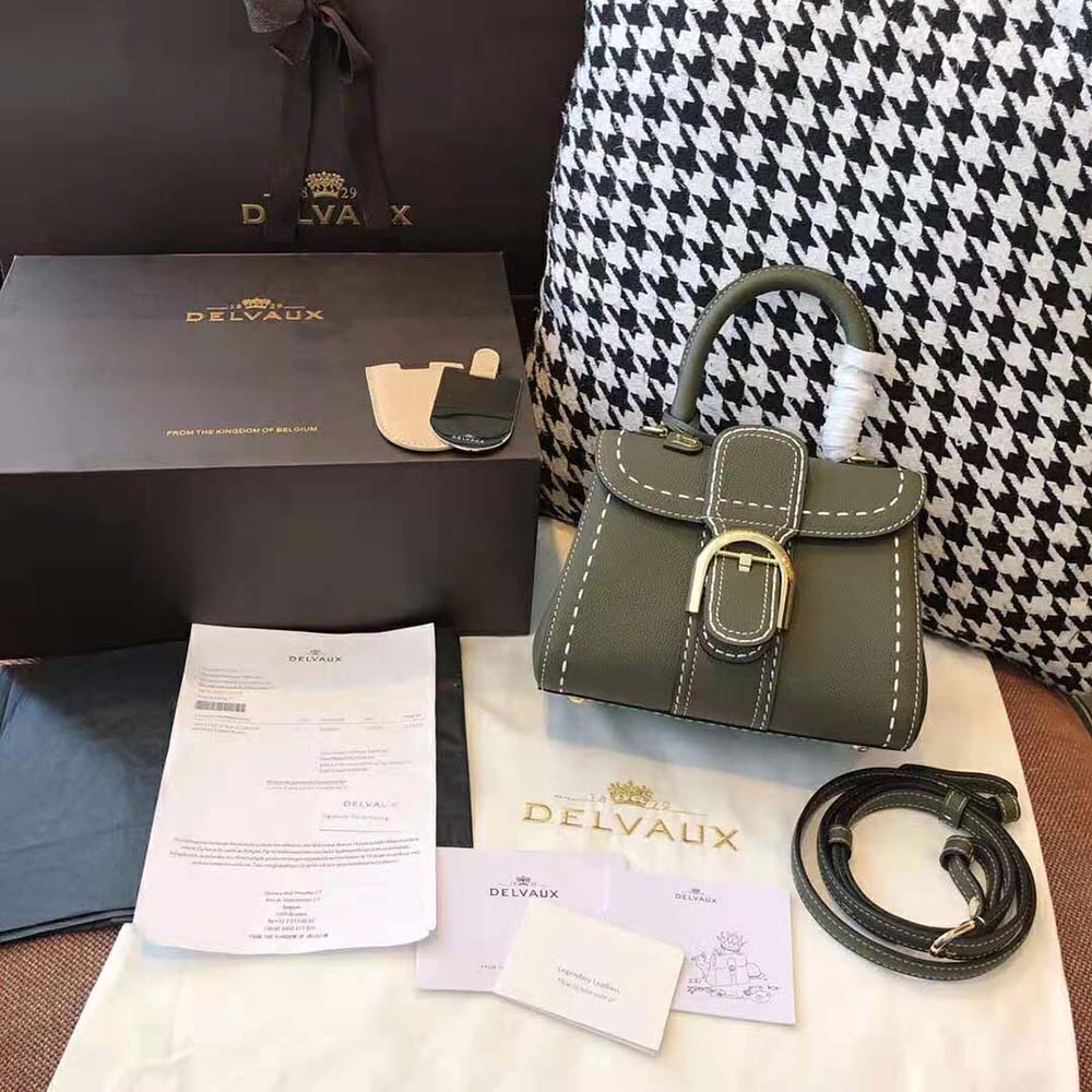 Close-up of Surpique stitching and gold hardware on Delvaux handbag