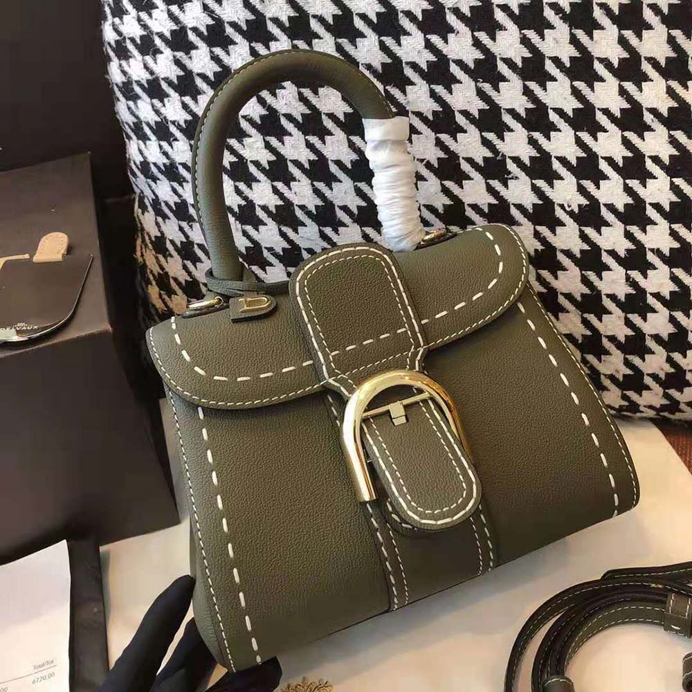 Side angle showing compact silhouette of Delvaux Women Brillant Mini