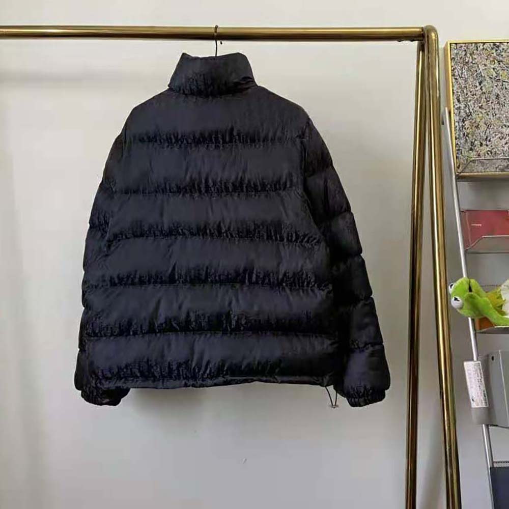 Side angle showing zipper and high collar on Dior Men Oblique Down Jacket
