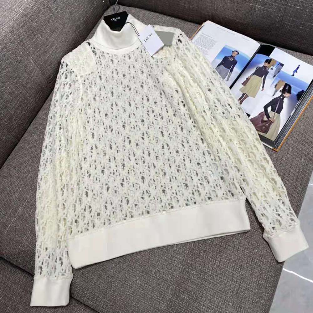 Close-up showing Dior Oblique print detail on white T-shirt