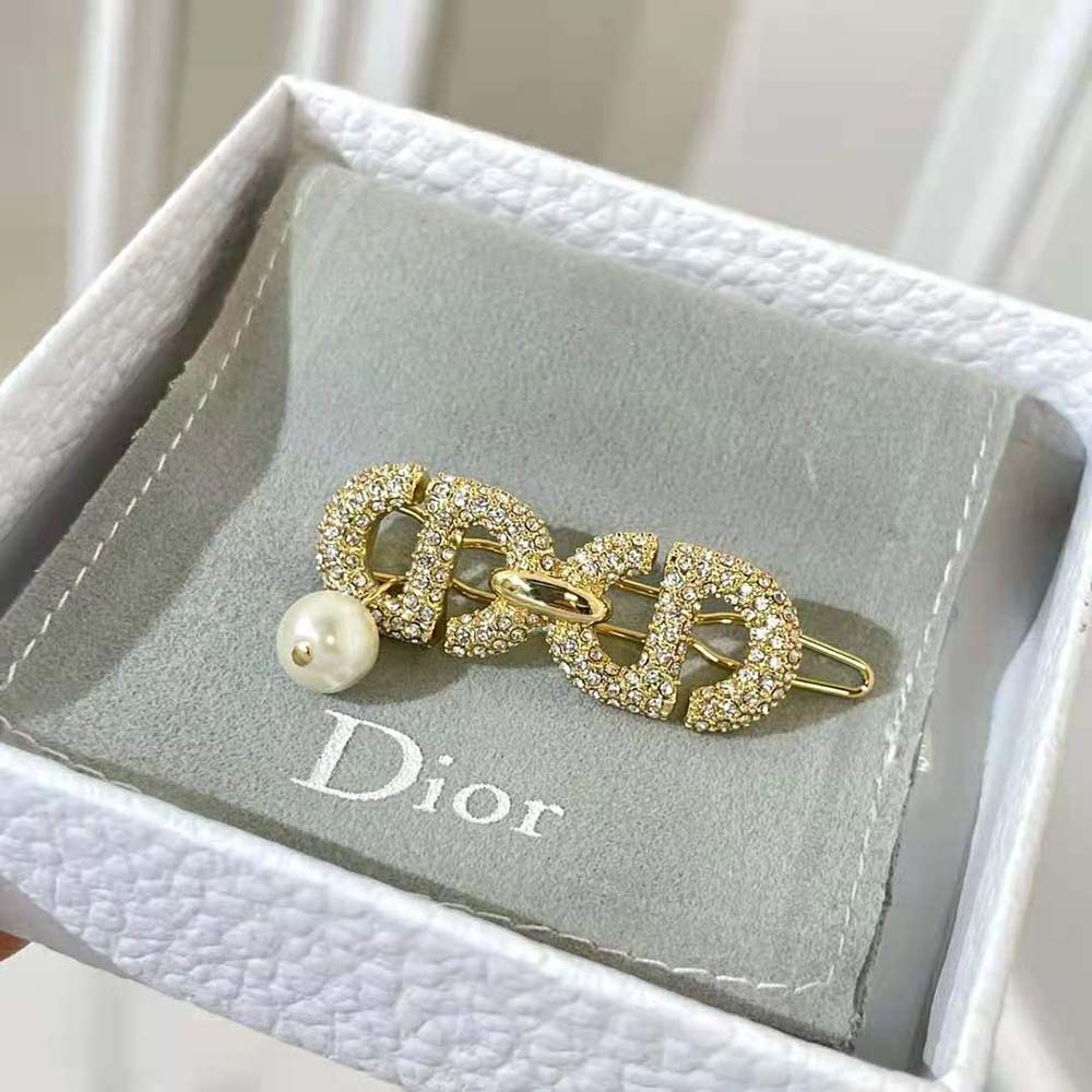 Styled hair with Dior Women CD Navy Barrette sparkling under light