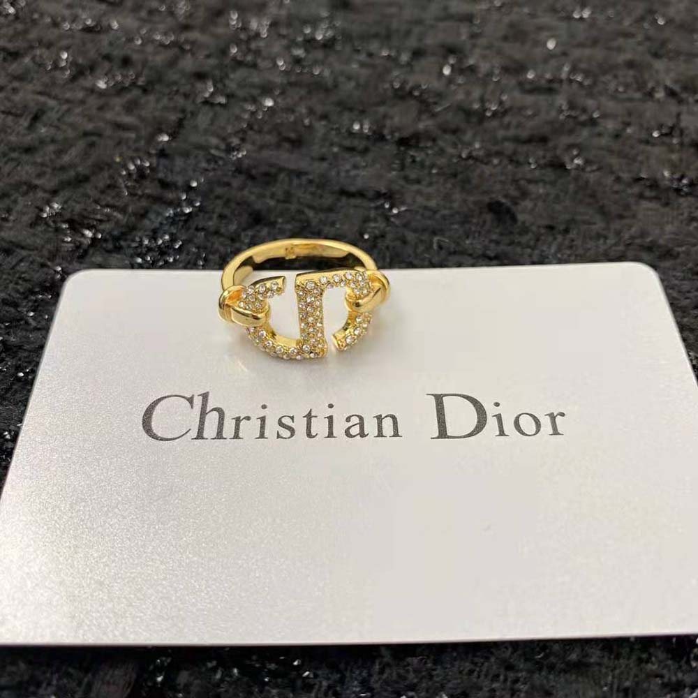 Worn on finger, Dior Women CD Navy Ring shining in gold and crystals