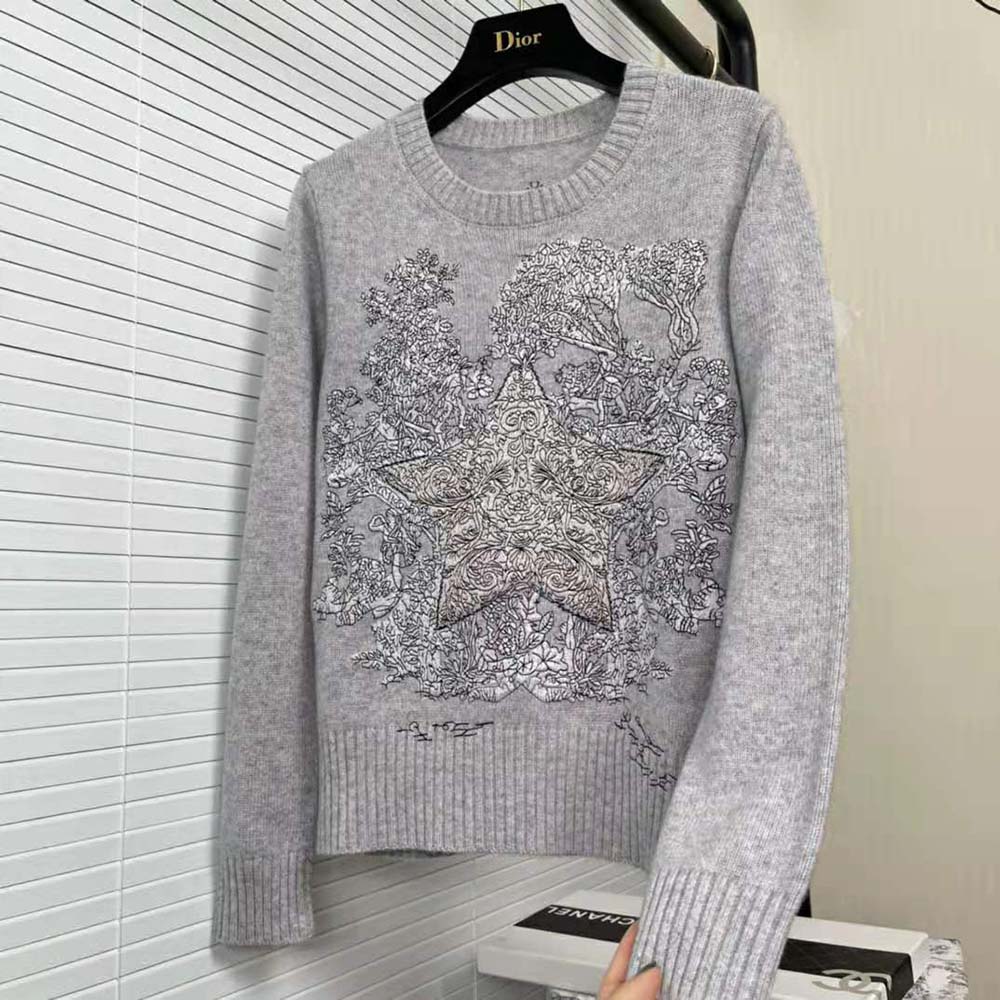 Side angle showing ribbed cuffs of Dior Women Chez Moi Sweater