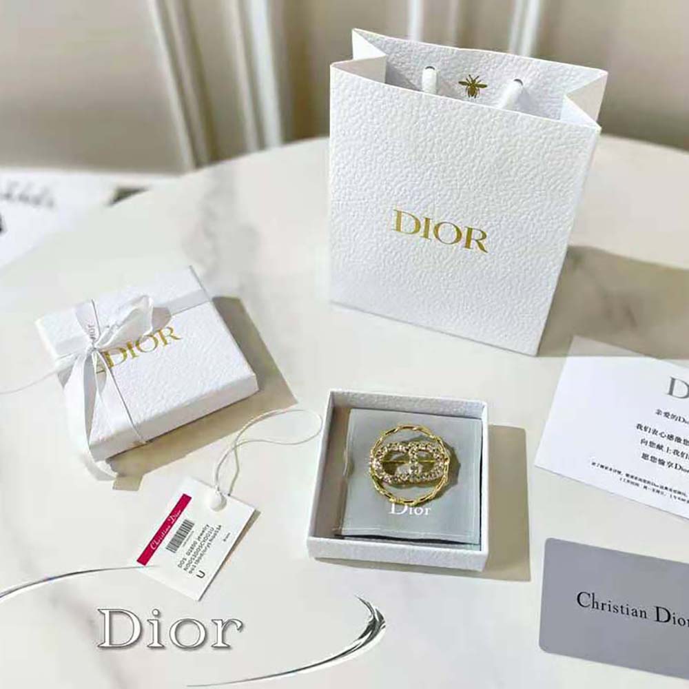 Close-up on white crystals and crescent moon detail on Dior Women Clair D Lune Brooch