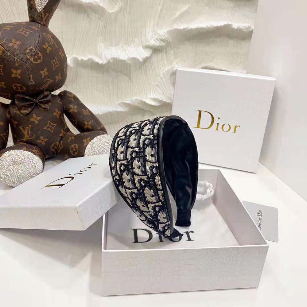 Close-up of Dior metal hardware detail on D-Oblique Headband Navy Cotton