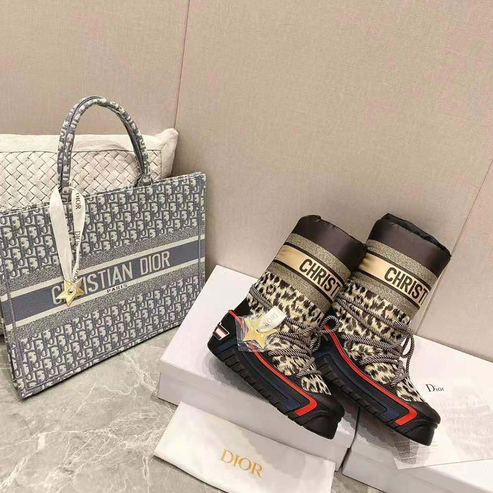 Close-up showing lace-up closure and embossed Dior hardware on snow boot