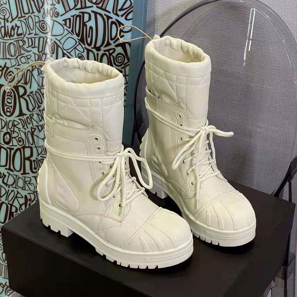 Side view showing silver Dioriron hardware on white Dioriron ankle boot