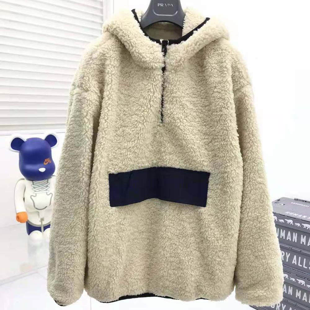 Close-up of Dior branded hardware on hooded anorak zipper